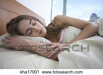 Stock Photography - woman sleeping 
in bed. fotosearch 
- search stock 
photos, pictures, 
images, and photo 
clipart