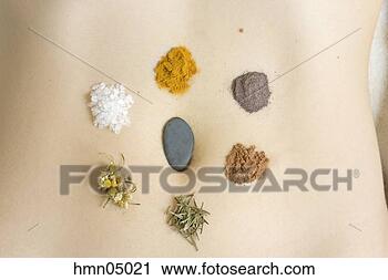 Stock Photography - woman with stone 
and spices on 
torso. fotosearch 
- search stock 
photos, pictures, 
images, and photo 
clipart