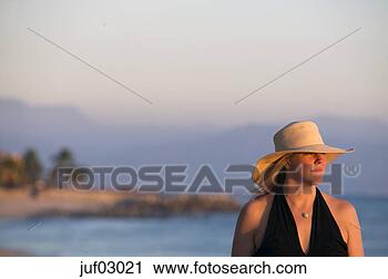 Stock Photography - woman in straw 
hat. fotosearch 
- search stock 
photos, pictures, 
images, and photo 
clipart