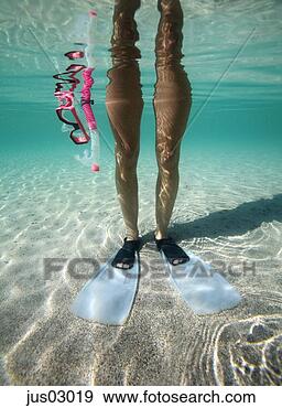 Stock Photograph - woman in swim 
fins underwater. 
fotosearch - search 
stock photos, 
pictures, images, 
and photo clipart