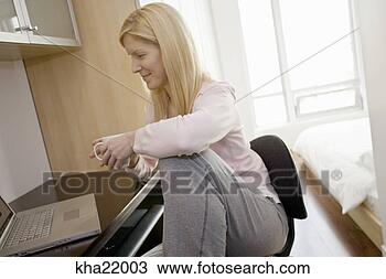 Stock Photo - woman using laptop. 
fotosearch - search 
stock photos, 
pictures, images, 
and photo clipart