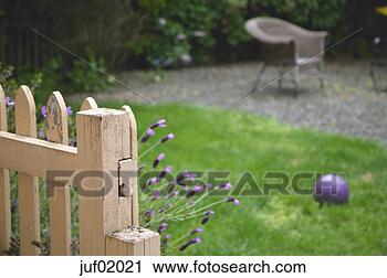 Stock Photography - wooden fence with 
flowers growing 
beside it. fotosearch 
- search stock 
photos, pictures, 
images, and photo 
clipart