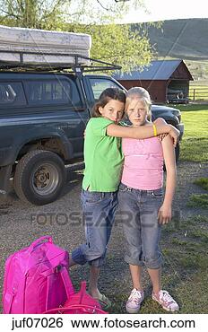 Stock Photo - young girls embracing 
as one leaves. 
fotosearch - search 
stock photos, 
pictures, images, 
and photo clipart