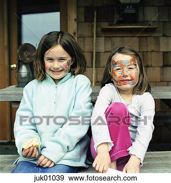 Stock Photograph - young girls posing 
with painted faces. 
fotosearch - search 
stock photos, 
pictures, images, 
and photo clipart