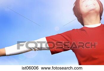 Stock Photo - young woman smiling 
in sunlight outdoors. 
fotosearch - search 
stock photos, 
pictures, images, 
and photo clipart