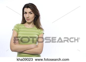 Stock Photo - young woman standing 
with arms crossed. 
fotosearch - search 
stock photos, 
pictures, images, 
and photo clipart