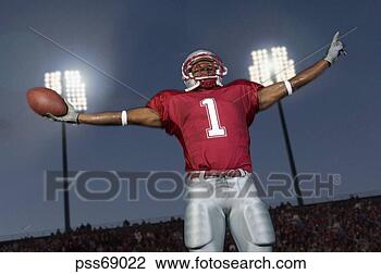 Stock Photo - african football 
player with arms 
outstretched. 
fotosearch - search 
stock photos, 
pictures, images, 
and photo clipart