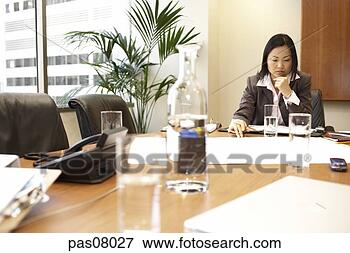 Picture - asian businesswoman 
working at conference 
table. fotosearch 
- search stock 
photos, pictures, 
images, and photo 
clipart