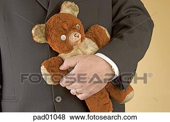 Stock Photo - businessman holding 
teddy bear. fotosearch 
- search stock 
photos, pictures, 
images, and photo 
clipart