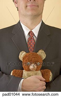 Stock Photo - businessman hugging 
teddy bear. fotosearch 
- search stock 
photos, pictures, 
images, and photo 
clipart