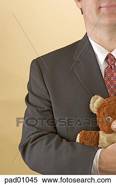 Stock Image - businessman hugging 
teddy bear. fotosearch 
- search stock 
photos, pictures, 
images, and photo 
clipart