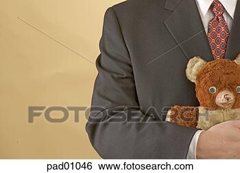 Stock Photo - businessman hugging 
teddy bear. fotosearch 
- search stock 
photos, pictures, 
images, and photo 
clipart