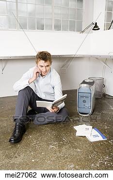 Stock Photo - businessman sitting 
on floor next 
to computer. fotosearch 
- search stock 
photos, pictures, 
images, and photo 
clipart