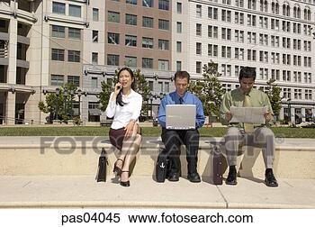 Stock Image - businesspeople 
working outdoors. 
fotosearch - search 
stock photos, 
pictures, images, 
and photo clipart