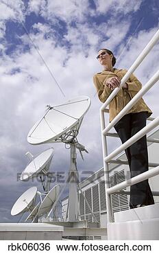 Stock Photo - businesswoman 
on balcony with 
satellite dishes. 
fotosearch - search 
stock photos, 
pictures, images, 
and photo clipart