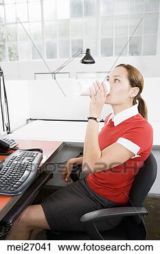 Stock Photography - businesswoman 
drinking takeout 
coffee. fotosearch 
- search stock 
photos, pictures, 
images, and photo 
clipart