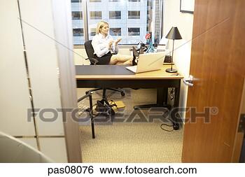 Stock Photo - businesswoman 
filing her nails 
at desk. fotosearch 
- search stock 
photos, pictures, 
images, and photo 
clipart