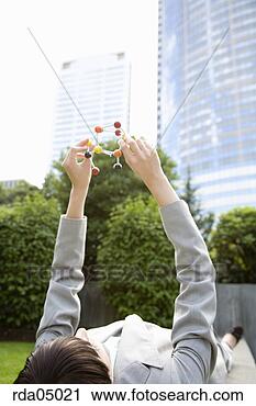 Stock Photography - businesswoman 
holding molecular 
model. fotosearch 
- search stock 
photos, pictures, 
images, and photo 
clipart