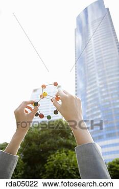 Stock Photo - businesswoman 
holding molecular 
model. fotosearch 
- search stock 
photos, pictures, 
images, and photo 
clipart