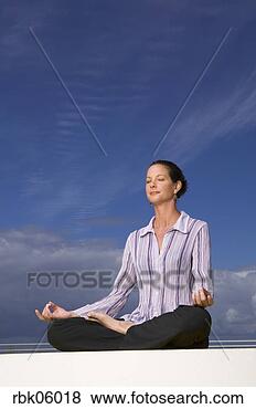 Stock Photo - businesswoman 
meditating outdoors. 
fotosearch - search 
stock photos, 
pictures, images, 
and photo clipart