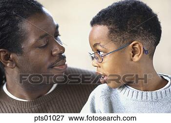 Picture - close up of father 
and son talking 
face to face. 
fotosearch - search 
stock photos, 
pictures, images, 
and photo clipart