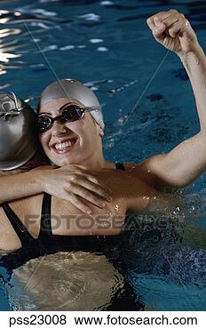 Stock Photo - close-up of swimmers 
celebrating success 
in swimming pool. 
fotosearch - search 
stock photos, 
pictures, images, 
and photo clipart
