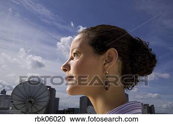 Stock Photography - close-up of woman 
near satellite 
dish. fotosearch 
- search stock 
photos, pictures, 
images, and photo 
clipart