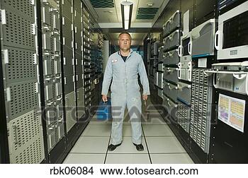 Stock Photo - computer repairman 
standing in computer 
room. fotosearch 
- search stock 
photos, pictures, 
images, and photo 
clipart