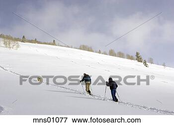 Picture - cross-country 
skiers climbing 
hill. fotosearch 
- search stock 
photos, pictures, 
images, and photo 
clipart