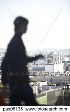 Stock Image - defocused man 
with city in background. 
fotosearch - search 
stock photos, 
pictures, images, 
and photo clipart