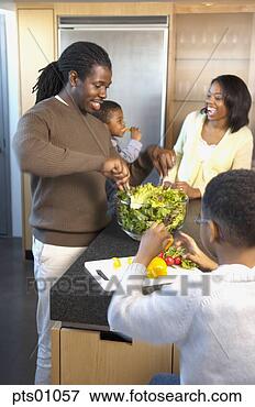 Picture - family preparing 
meal in kitchen, 
father tossing 
salad. fotosearch 
- search stock 
photos, pictures, 
images, and photo 
clipart
