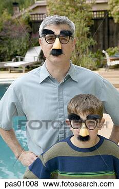 Stock Photo - father and son 
in disguises. 
fotosearch - search 
stock photos, 
pictures, images, 
and photo clipart