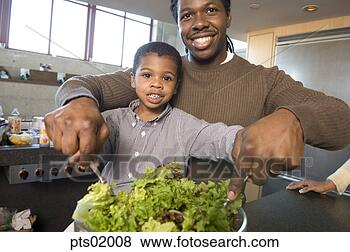 Stock Photo - father and son 
tossing salad. 
fotosearch - search 
stock photos, 
pictures, images, 
and photo clipart