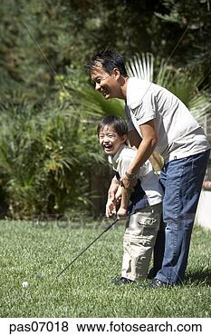 Stock Photo - father teaching 
his son to play 
golf. fotosearch 
- search stock 
photos, pictures, 
images, and photo 
clipart