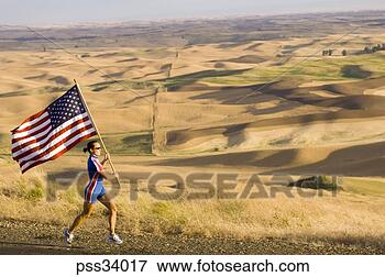Picture - female athlete 
with american 
flag on roadside. 
fotosearch - search 
stock photos, 
pictures, images, 
and photo clipart