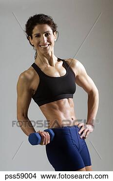 Stock Photo - female athlete 
lifting weights. 
fotosearch - search 
stock photos, 
pictures, images, 
and photo clipart