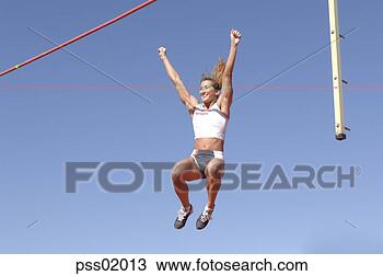 Stock Photo - female athlete 
pole vaulting. 
fotosearch - search 
stock photos, 
pictures, images, 
and photo clipart