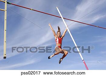 Picture - female athlete 
pole vaulting. 
fotosearch - search 
stock photos, 
pictures, images, 
and photo clipart