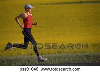 Stock Photo - female athlete 
running on rural 
road. fotosearch 
- search stock 
photos, pictures, 
images, and photo 
clipart