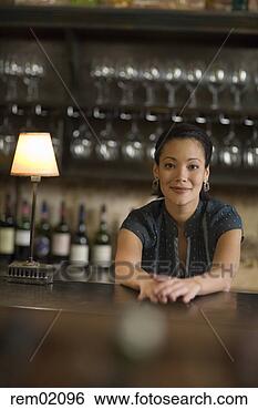 Stock Photo - female bartender 
leaning on bar 
counter. fotosearch 
- search stock 
photos, pictures, 
images, and photo 
clipart
