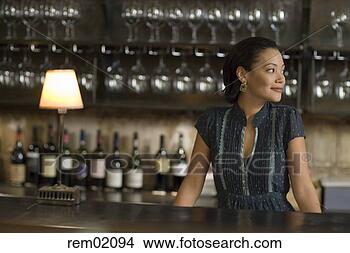 Stock Photo - female bartender 
standing at bar 
counter. fotosearch 
- search stock 
photos, pictures, 
images, and photo 
clipart