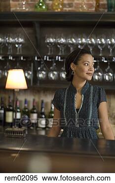 Stock Image - female bartender 
standing at bar 
counter. fotosearch 
- search stock 
photos, pictures, 
images, and photo 
clipart