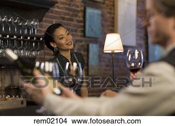 Stock Photo - female bartender 
talking to customers. 
fotosearch - search 
stock photos, 
pictures, images, 
and photo clipart
