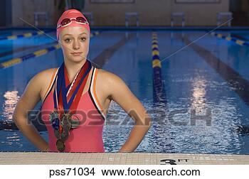 Stock Photo - female swimmer 
wearing medals. 
fotosearch - search 
stock photos, 
pictures, images, 
and photo clipart