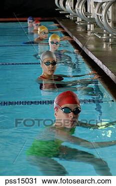 Stock Photography - female swimmers 
preparing for 
competitive race. 
fotosearch - search 
stock photos, 
pictures, images, 
and photo clipart