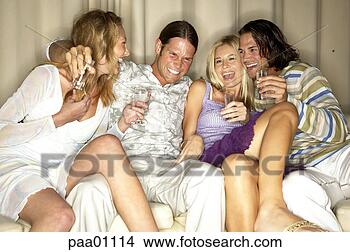 Stock Photo - friends having 
drinks on sofa. 
fotosearch - search 
stock photos, 
pictures, images, 
and photo clipart