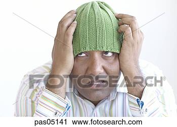 Stock Photography - frustrated hispanic 
man in hat. fotosearch 
- search stock 
photos, pictures, 
images, and photo 
clipart