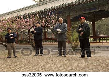 Stock Image - group of senior 
asian men practicing 
tai chi. fotosearch 
- search stock 
photos, pictures, 
images, and photo 
clipart
