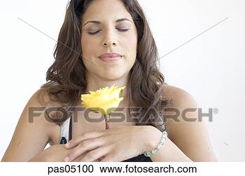 Stock Photography - hispanic woman 
smelling flower. 
fotosearch - search 
stock photos, 
pictures, images, 
and photo clipart