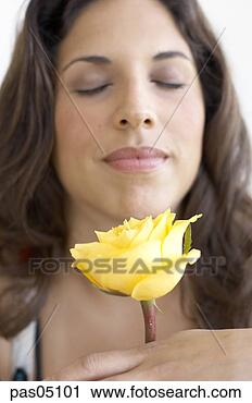 Stock Photography - hispanic woman 
smelling flower. 
fotosearch - search 
stock photos, 
pictures, images, 
and photo clipart